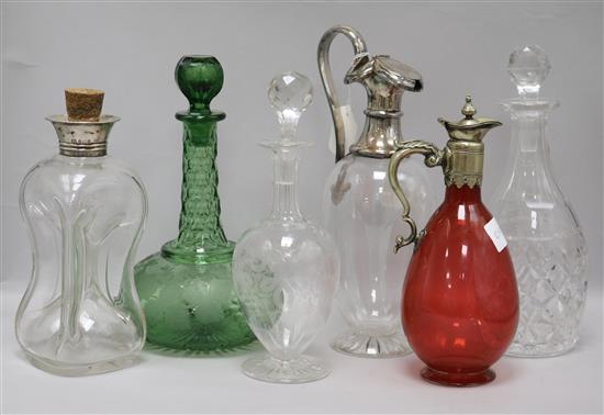Six assorted decanters including silver collar and two plate mounted tallest 29cm